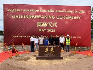 People standing at a groundbreaking ceremony in Thailand.